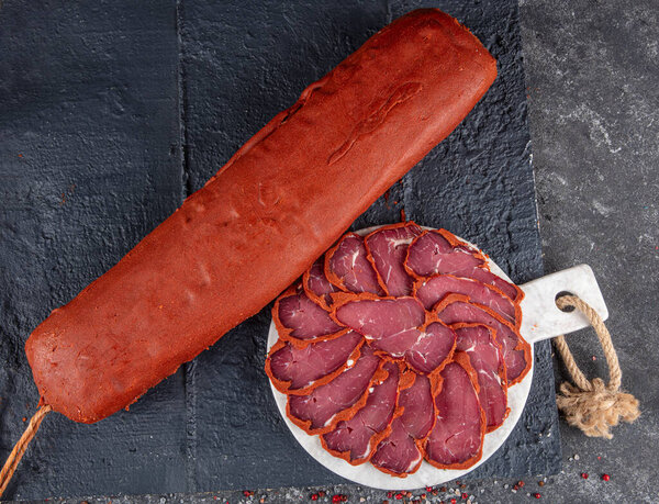 Turkish bacon, pastrami ( kayseri pastirma ) Fresh sliced pastrami. Pastrami ( dried meat with spices ). beef bacon sliced. traditional turkish food pastirma.