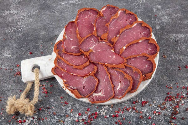 Turkish bacon, pastrami ( kayseri pastirma ) Fresh sliced pastrami. Pastrami ( dried meat with spices ). beef bacon sliced. traditional turkish food pastirma.