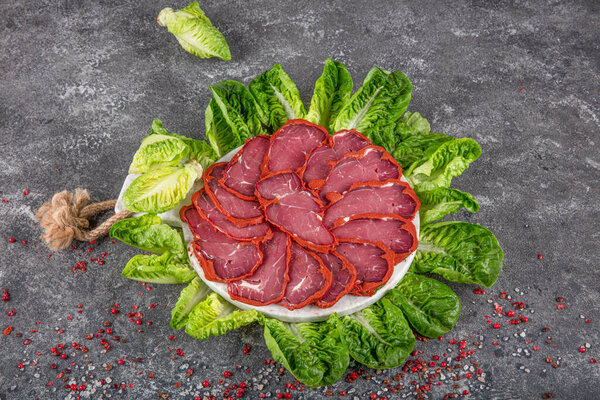 Turkish bacon, pastrami ( kayseri pastirma ) Fresh sliced pastrami. Pastrami ( dried meat with spices ). beef bacon sliced. traditional turkish food pastirma.