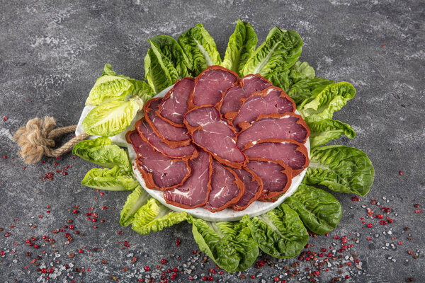 Turkish bacon, pastrami ( kayseri pastirma ) Fresh sliced pastrami. Pastrami ( dried meat with spices ). beef bacon sliced. traditional turkish food pastirma.