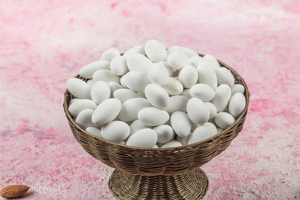 Close up of a group of white sugared almonds. Almond candies. Candies background top view, almond sweets. Sugar Feast, (Feast of Ramadan) Ramadan concepts.