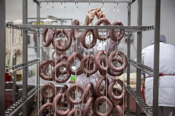 The sausage on the meat plant prepared for Smoking. Production of delicacies. Sausages (Sucuk) in the factory storage. Sausage production line. Industrial manufacture of sausages.