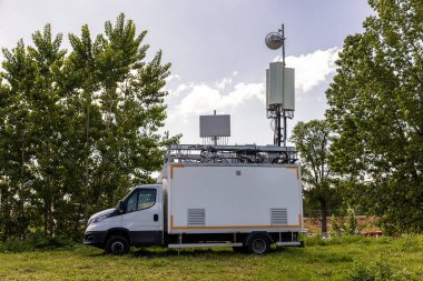 Cell on Wheels (COW) is a portable base station used to provide temporary cellular network coverage for high-profile events and emergency situations where existing base stations become damaged.