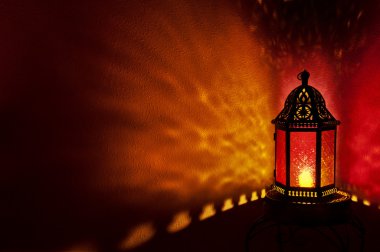 Moroccan lantern with colored glass at night time clipart