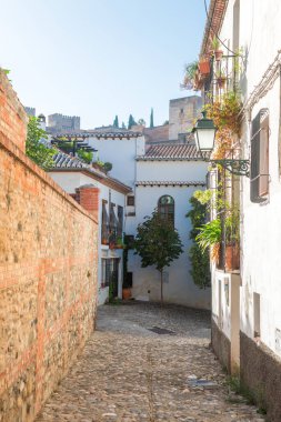 beautiful streets of albaicin district in granada, Spain clipart