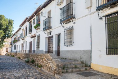 beautiful streets of albaicin district in granada, Spain clipart