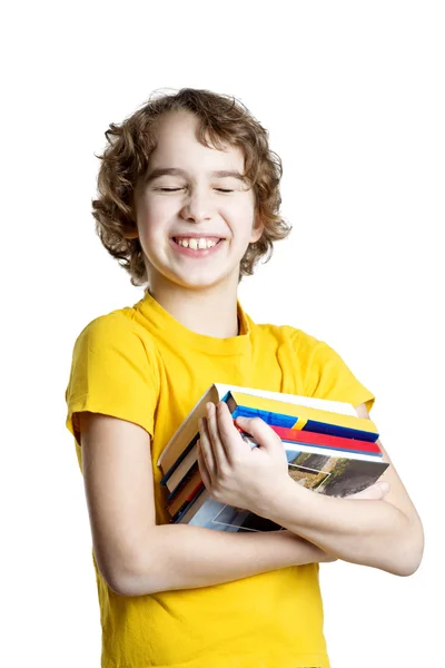 Menino está segurando livros — Fotografia de Stock