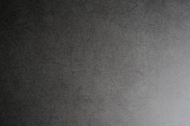 Koyu gri beton arka plan dokusu eğimle çizilmiş.