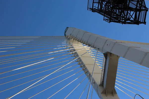 Close-up of a fragment of the cable-stayed bridge pylon in the place where the cables are fastened