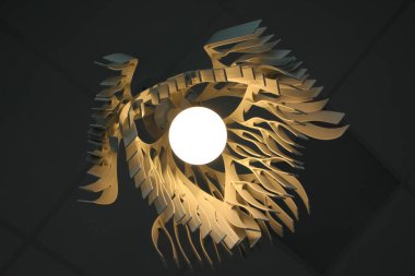 Karmaşık geometrik şekilli yanan bir lambanın altından görüntüle