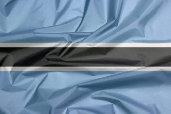 Botswanská Vlajka Záhyb Botswana Vlajky Pozadí Černý Pruh Tenkým Bílým — Stock fotografie