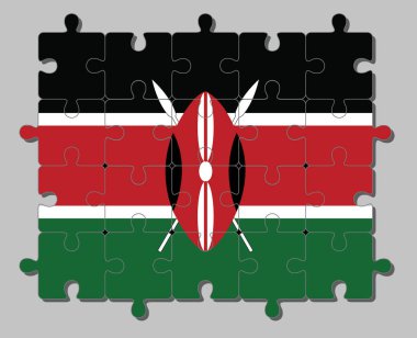 Kırmızı ve siyah Maasai kalkanının arkasında iki çapraz beyaz mızraklı siyah beyaz ve siyah Kenya bayrağının yapbozu. Tamamlanma ya da mükemmellik kavramı.