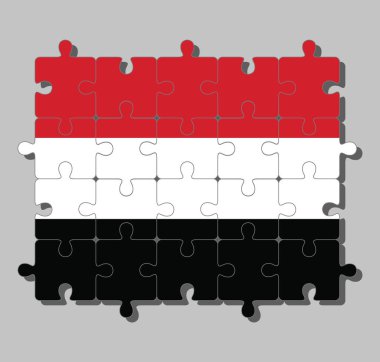 Kırmızı, beyaz ve siyah üç renkli bir yapboz Yemen bayrağı. Tamamlanma ya da mükemmellik kavramı.