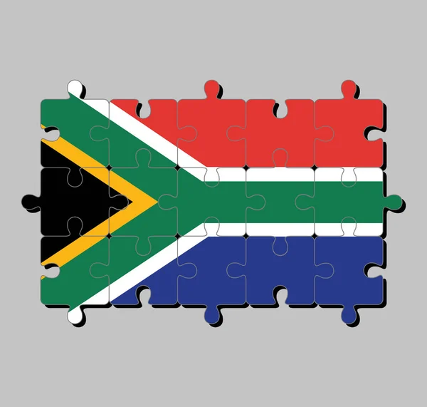 黒の三角形 白と緑の水平Yと三角形に対して金と赤と青で南アフリカのフラグのジグソーパズル 完成又は完成の概念 — ストックベクタ