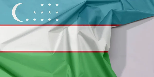 Ткань Флага Узбекистана Блины Складки Белым Пространством Синие Белые Зеленые — стоковое фото