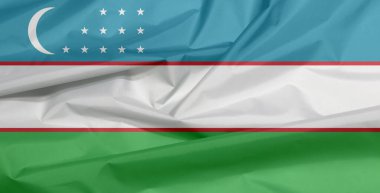 Özbekistan 'ın kumaş bayrağı. Özbek bayraklı arka plan kırışıklıkları, mavi beyaz ve yeşil çizgiler, iki dar kırmızı şeritle ayrılmış. Bir hilal ve üç sıra on iki yıldız..