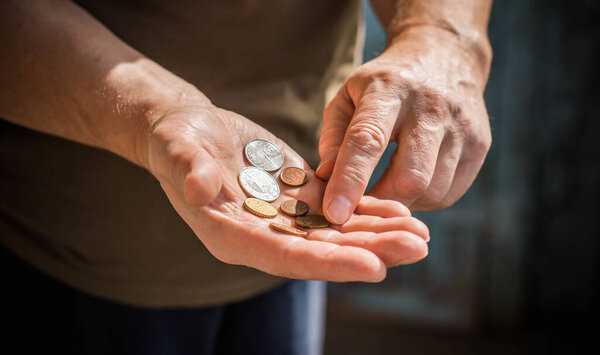 Concept of poverty, and destitution, money and coins. Poor people, need a help