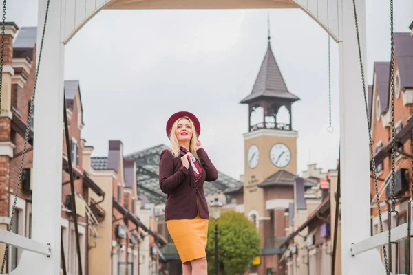 Woman at city, plus size blonde nice woman outdoor portrait. Pretty nice lady in fashionable warm outfit, lifestyle, shopping time, woman at walk