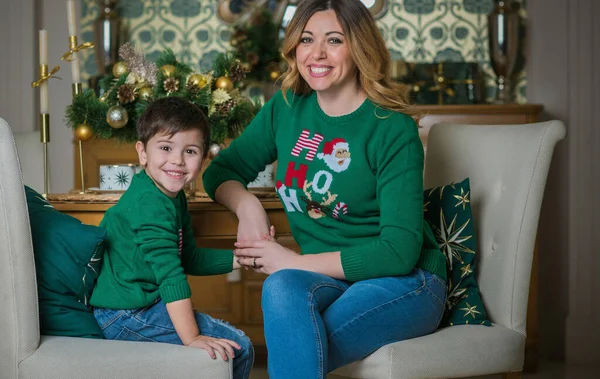 Family scene mom and boy, Christmas time. Nice mom and little child at Christmas time, children and parents lifestyle