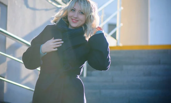 Concept of life modern woman in big city, lifestyle citizen peoples, lady at spring or autumn day. Middle age woman in coat and scarf walk around center streets