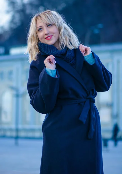 Concept of life modern woman in big city, lifestyle citizen peoples, lady at spring or autumn day. Middle age woman in coat and scarf walk around center streets