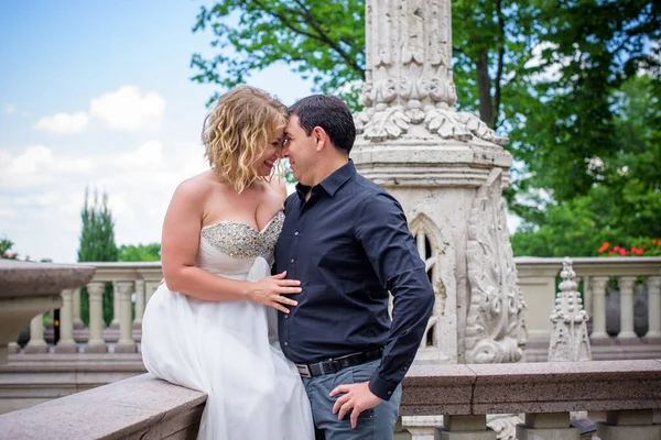 Blond bride and groom on wedding. Happy wedding couple. Beautiful bride, young woman in white dress groom kissing and having fun in outdoor on summer day. Just married, young family.