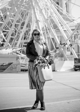 Concept of life modern woman in big city, lifestyle citizen peoples, lady at spring or autumn day. Middle age woman plus size , walk around center streets