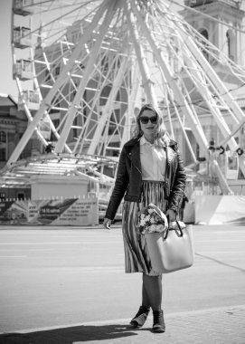 Concept of life modern woman in big city, lifestyle citizen peoples, lady at spring or autumn day. Middle age woman plus size , walk around center streets