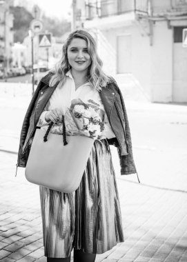 Concept of life modern woman in big city, lifestyle citizen peoples, lady at spring or autumn day. Middle age woman plus size , walk around center streets