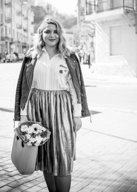 Concept of life modern woman in big city, lifestyle citizen peoples, lady at spring or autumn day. Middle age woman plus size , walk around center streets