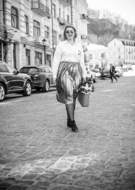 Concept of life modern woman in big city, lifestyle citizen peoples, lady at spring or autumn day. Middle age woman plus size , walk around center streets
