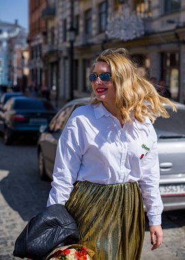 Concept of life modern woman in big city, lifestyle citizen peoples, lady at spring or autumn day. Middle age woman plus size , walk around center streets