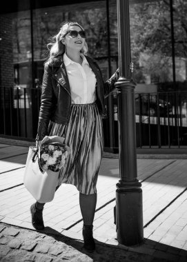 Concept of life modern woman in big city, lifestyle citizen peoples, lady at spring or autumn day. Middle age woman plus size , walk around center streets