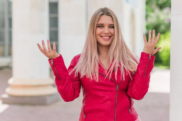 Happy woman of plus size, American or European appearance walks in the city enjoying life. Young lady with excess weight, stylishly dressed at the city park .Natural beauty