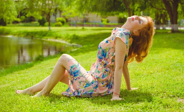 Woman rest on a nature. Concept of vacation or weekend. Young stylish lady relax outdoor. Good and romantic mood. Love the life and joy. Pieces of life