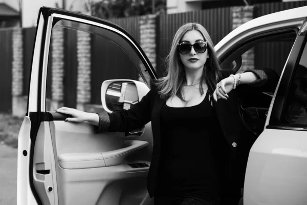 Business woman in a car, auto lady concept. Stylish lady sit in automobile