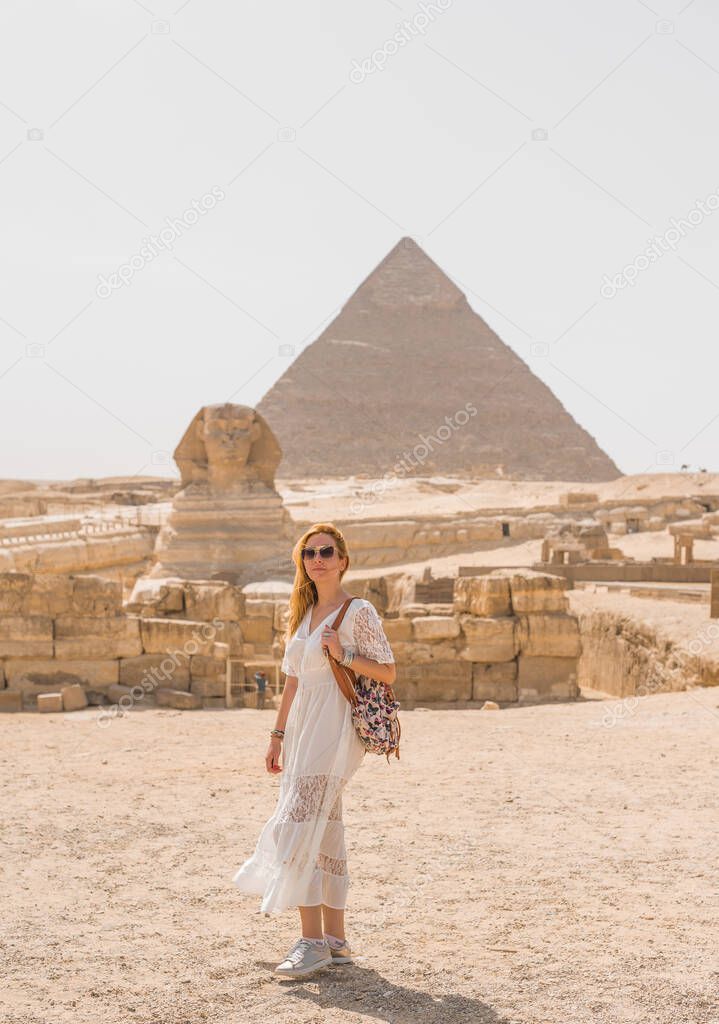 Tourism in Egypt, woman with a view on a pyramids