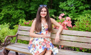 Hispanic pretty young woman rest at summer time. Latina Woman relax at nature and enjoy the life