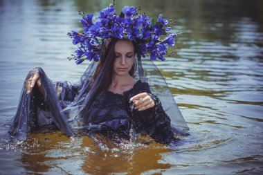 Black bride at water, Slavic rituals, pagan magic scene, old magic power concept