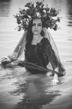 Black bride at water, Slavic rituals, pagan magic scene, old magic power concept