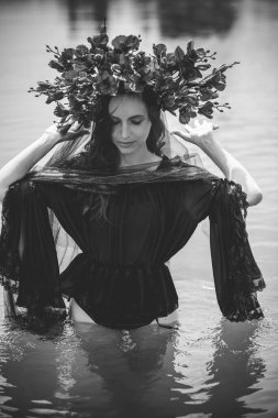 Black bride at water, Slavic rituals, pagan magic scene, old magic power concept