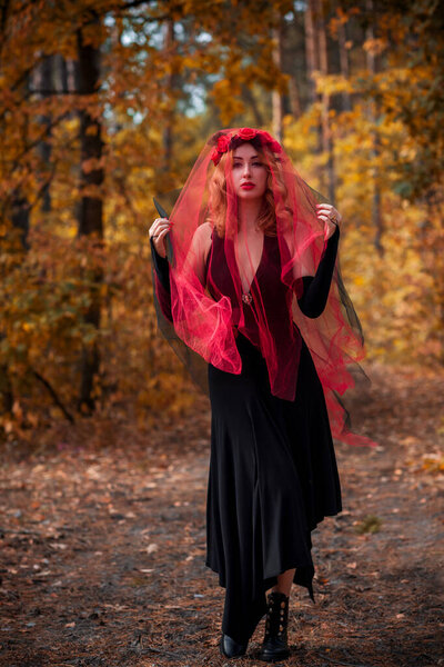 Magical time, Autumn bride with red veil . Costume and ideas for party, lady's witchcraft