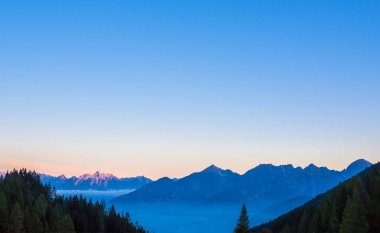 Hallstatt Village, Austria. Scenic Alpine Landscape with Traditional Houses and Calm Water Reflections