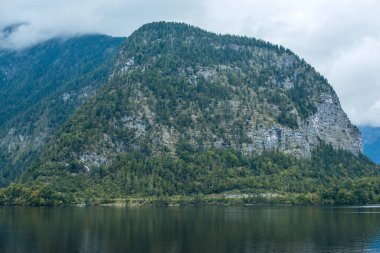 Hallstatt Village, Austria. Scenic Alpine Landscape with Traditional Houses and Calm Water Reflections
