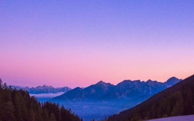 Hallstatt Village, Austria. Scenic Alpine Landscape with Traditional Houses and Calm Water Reflections