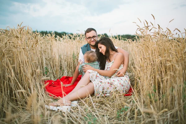 Young hipster father, mother cute baby son on picnic — Stock Photo, Image