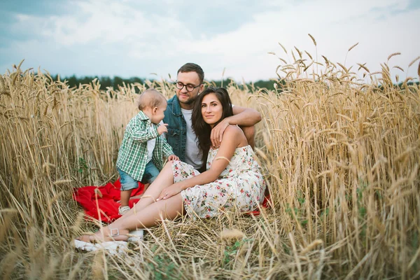 Young hipster father, mother cute baby son on picnic — Stock Photo, Image