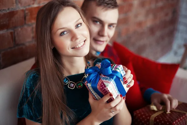 Lovely couple on the coach — Stock Photo, Image