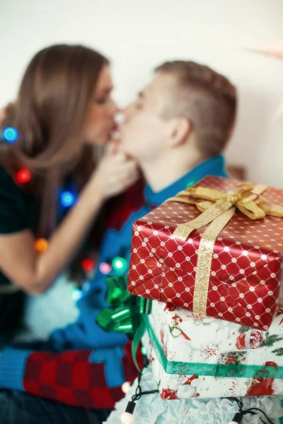 Lovely couple kissing on the coach Royalty Free Stock Images