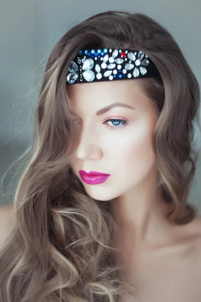 Portrait of beautiful woman with flowers in hair and blue eyes — Stock Photo, Image